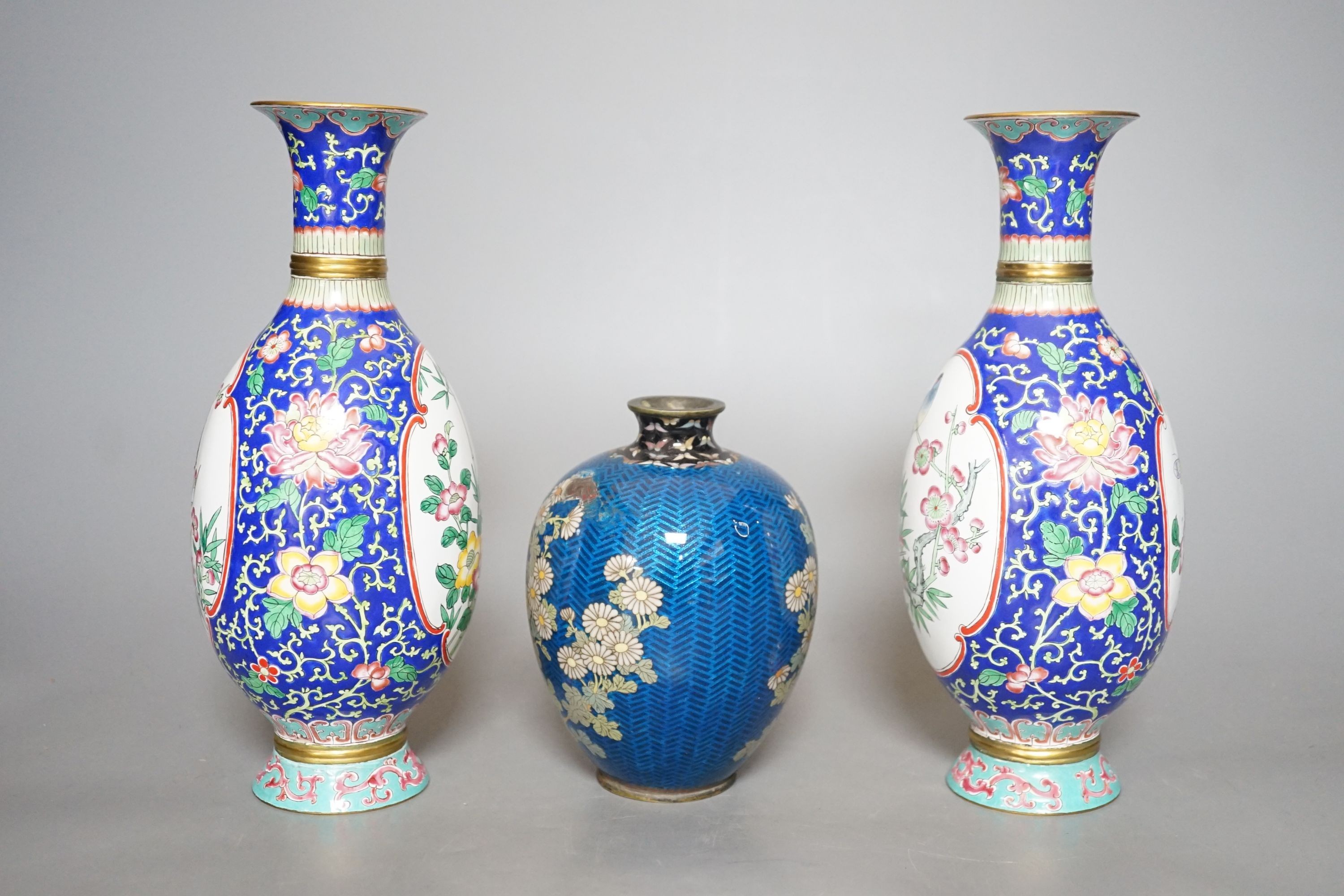 A Japanese floral cloisonné enamel vase, 13cm tall, together with two Canton enamel vases